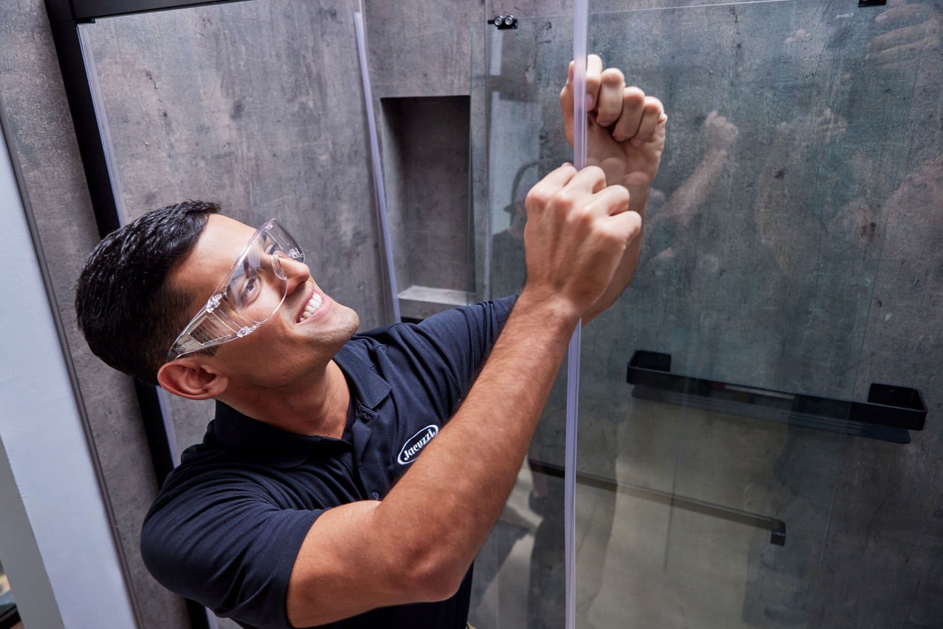 Jacuzzi Bath Remodel installer fitting a new shower wall